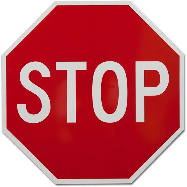 Reflective octagonal stop sign with white STOP legend on red background