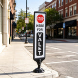 44-inch spring-back valet parking sign stand installed at curbside