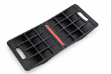 Heavy-duty double-sided parking mat underside with reinforcing ribs, carry handles and adhesive strip